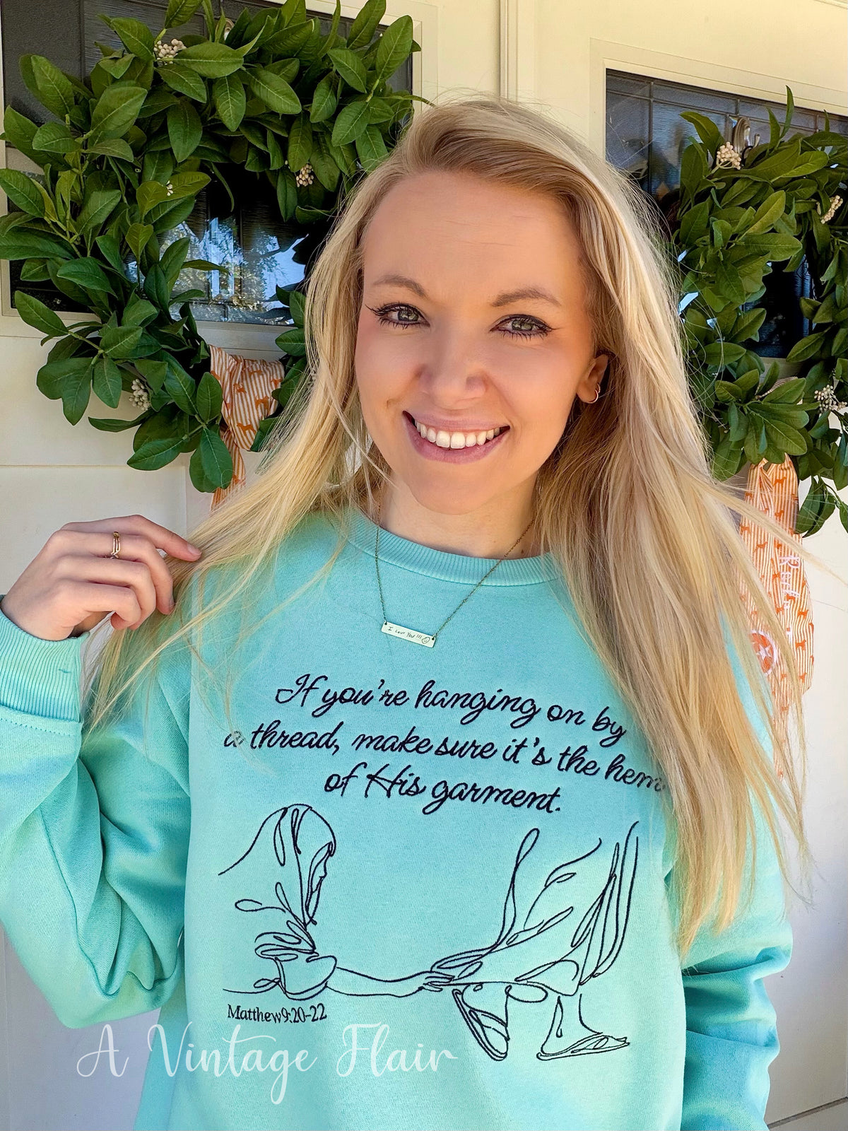 Hanging by a Thread Embroidered Sweatshirt